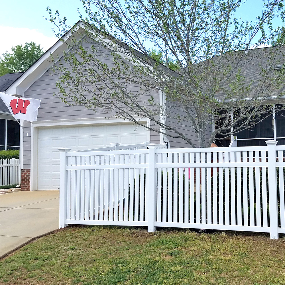 wood or vinyl fence in backyard space